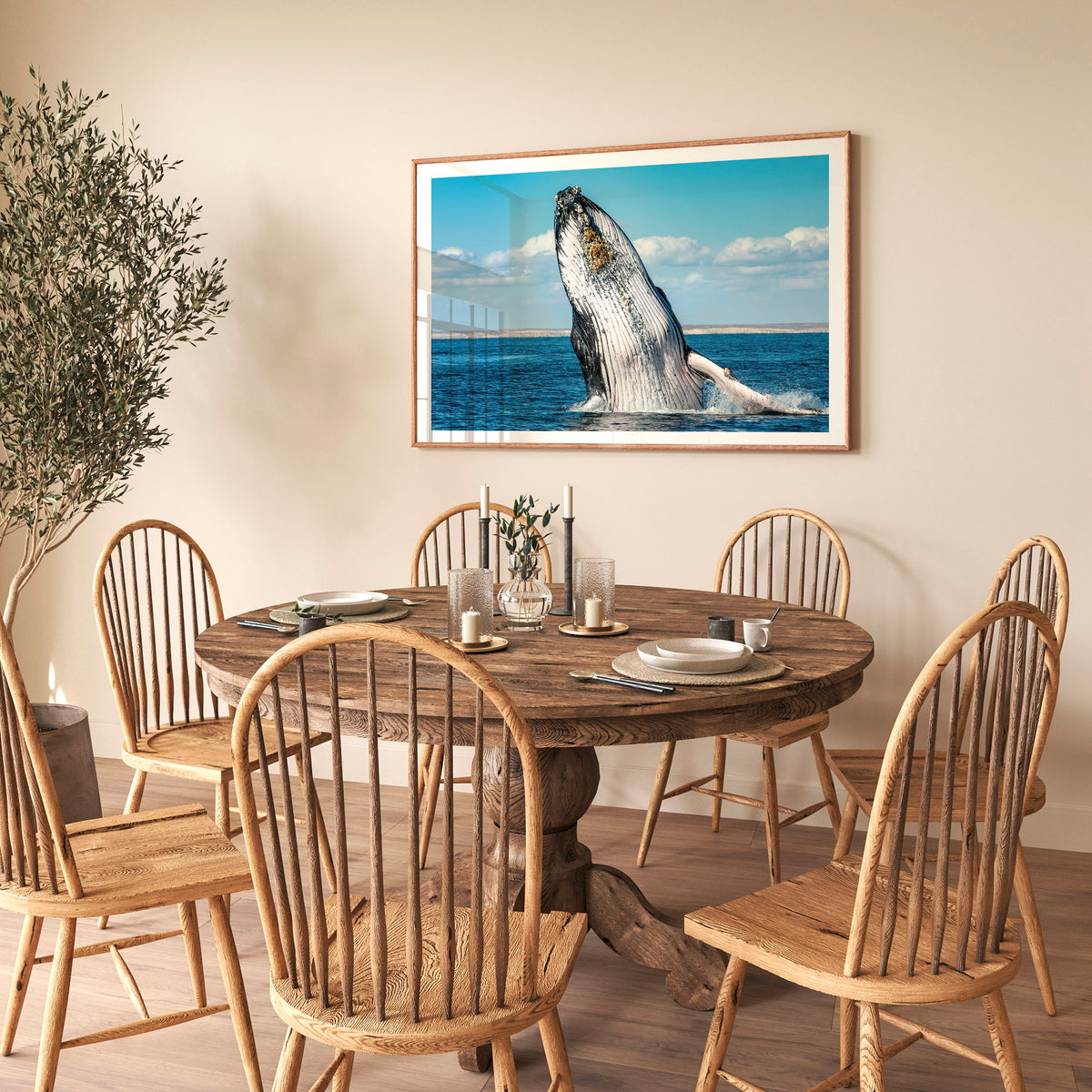 Room mockup above a dining table: Humpback Highway — humpback whale breaching above the sea.