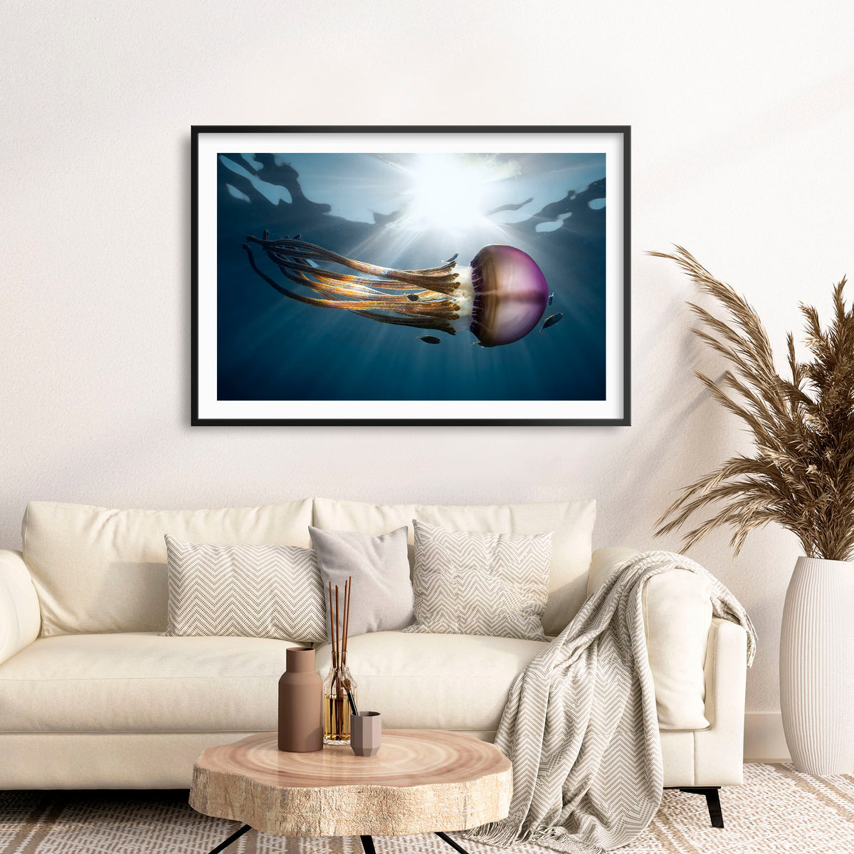 Room mockup above a sofa: Rasta Jelly III — jellyfish with long trailing tentacles.