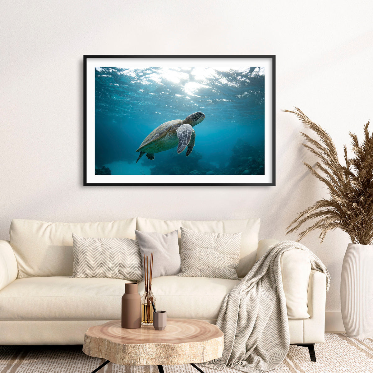Room mockup above a sofa: Turtle Garden — turtle swimming beneath the sunlit ocean surface.