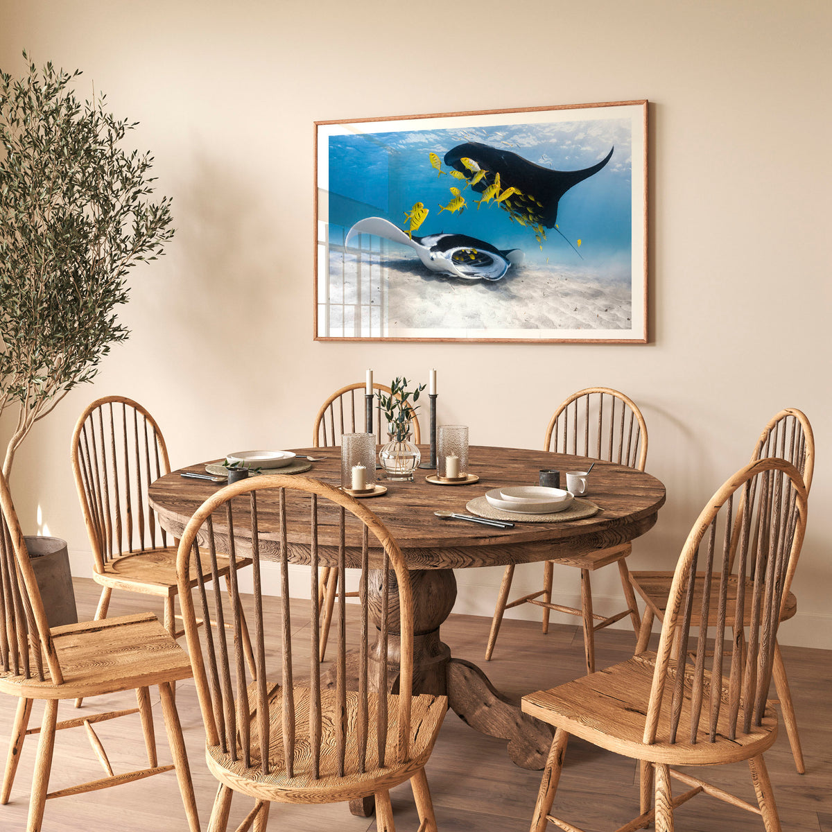 Room mockup above a dining table: Traffic — two manta rays and yellow fish above a sandy seabed.
