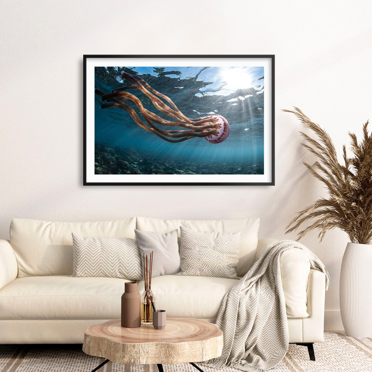Room mockup above a sofa: Jellyfish magic — jellyfish near the sunlit ocean surface.